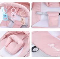 كرسي هزاز قماشي للرضع مع العاب معلقة وعجلات دوارة