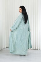 جلابية قماش بطول يصل للكاحل مكونة من قطعة سادة وقط...