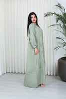 جلابية قماش بطول يصل للكاحل بنهايات أكمام واسعة وي...