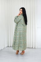 جلابية قماش بطول يصل للكاحل ونهايات أكمام واسعة وي...