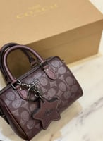 حقيبة كوتش ميني روان عنابي فوري