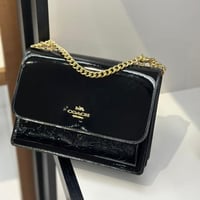 حقيبة كوتش كلير لماع اسود فوري