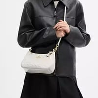 حقيبة كتف كوتش تيري جلد سيغنتشر مع تعليقة قلب تصل...