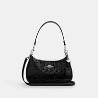 حقيبة كتف كوتش تيري جلد سيغنتشر مع تعليقة قلب تصل...