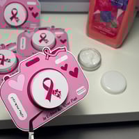 توزيعات لوشن ميني -بثيم التوعية من سرطان الثدي