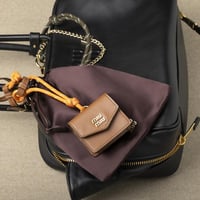 تعليقة miumiu جلد وحبل وحقيبة صغيرة