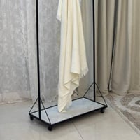 علاق ملابس اسود بقاعدة سيراميك كفرات