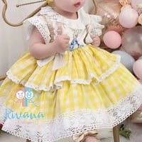 فستان كاروهات الأصفر والأبيض