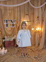 فستان مواليد ازرق فاتح بتفاصيل انيقه