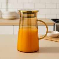 إبريق زجاجي شفاف بغطاء ذهبي – تصميم عصري أنيق