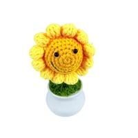 زهرة عباد الشمس الكروشيه المبتسمة في أصيص