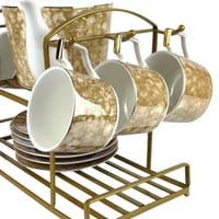 طقم شاي فاخر من البورسلان مع حامل معدني ذهبي