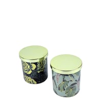 شمعة معطرة بزخارف نباتية وغطاء ذهبي