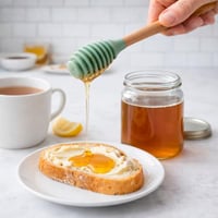 ملعقة عسل سيليكون بيد خشب