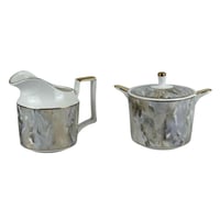 طقم شاي بورسلان بنقشة رخامية مع حامل ذهبي