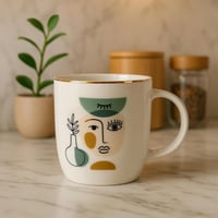 كوب سيراميك بتصميم فني بلمسة ذهبية