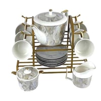 طقم شاي بورسلان بنقشة رخامية مع حامل ذهبي