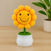 زهرة عباد الشمس الكروشيه المبتسمة في أصيص