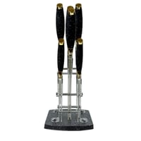 طقم سكاكين مطبخ فاخر بمقابض سوداء مزخرفة ولمسات ذه...