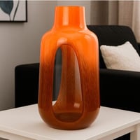 مزهرية زجاجية بتدرجات العنبر الدافئة