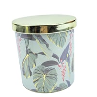 شمعة معطرة بزخارف نباتية وغطاء ذهبي