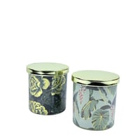 شمعة معطرة بزخارف نباتية وغطاء ذهبي