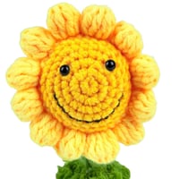 زهرة عباد الشمس الكروشيه المبتسمة في أصيص