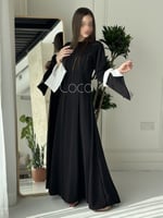 فستان اسود ناعم بلمسات باللون الابيض