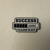 ملصقات معدنية جاري النجاح