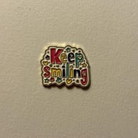 ملصقات معدنية كيب سمايلنق