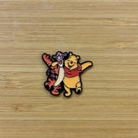 ملصقات معدنية وني ذا بو