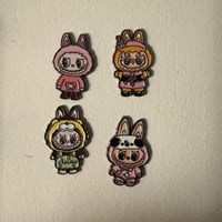 ملصقات معدنية لابوبو