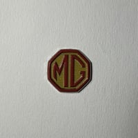 ملصقات معدنية ام جي