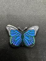 ملصق معدني فراشة زرقاء