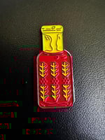 ملصق معدني قارورة