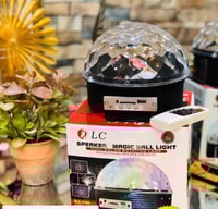 سماعة بلوتوث مع كرة بلورية مضيئة