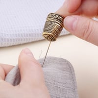 كشتبان معدني (ذهبي)