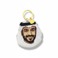 تطريز صورة اقرب للواقع على ميدالية مفاتيح