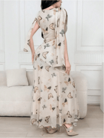 فستان سهرة أنيق باللون المشمشي تصميم مميز لإطلالة...