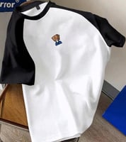 تي شيرت أكبر من المقاس مع رسومات كرتونية باللونين...