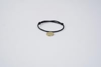 سوار أسود | عملة ذهبية