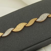 اسوارة ذهب مموجة وجهين ( عيار 18 )