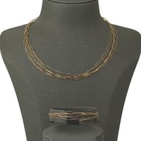 طقم خيوط الذهب المموجة ( عيار 18 )