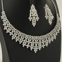 طقم ذهب ابيض براق (عيار 18)