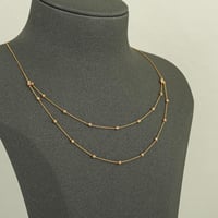 عقد كرات الذهب المتباعدة دورين ( عيار 21 )