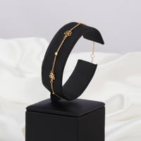 اسوارة ذهب الزهور باللون العودي ( عيار 18 )