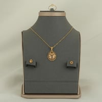 طقم ذهب بيضاوي مخطط ( عيار 21 )