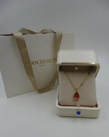 سلسال بوشرون ذهبي بجوهرة حمراء