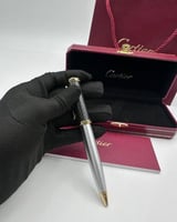 قلم كارتييه اسود باطراف فضيه