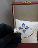 سوارة روبرتو كوين معصم ازرق و ذهبي